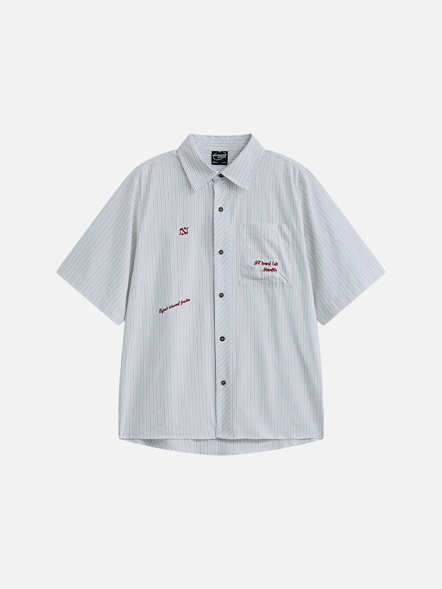Front view of an oversized striped button-down shirt with long sleeves