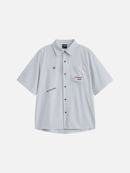 Front view of an oversized striped button-down shirt with long sleeves