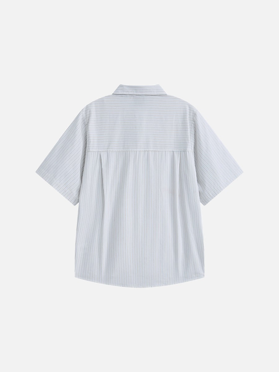 Rear view of the oversized striped button-down shirt