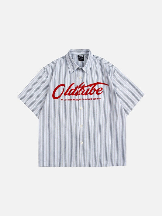 Front view of an oversized striped button-up shirt with script graphic