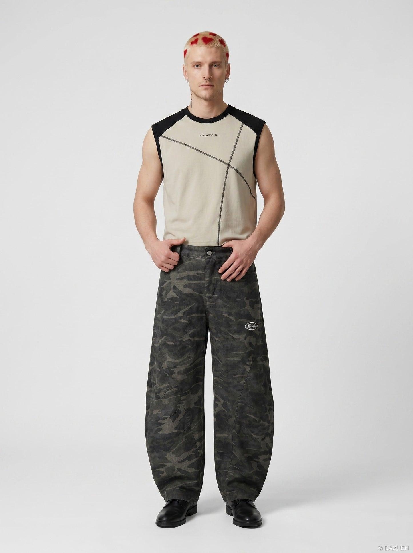 Graphic sleeveless raglan top paired with casual streetwear pieces