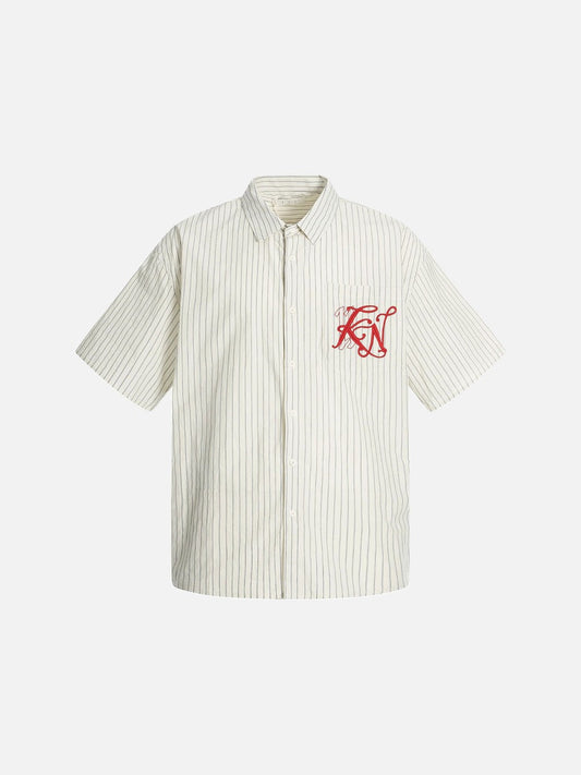 Front view of an oversized cream striped button-up shirt with red embroidery