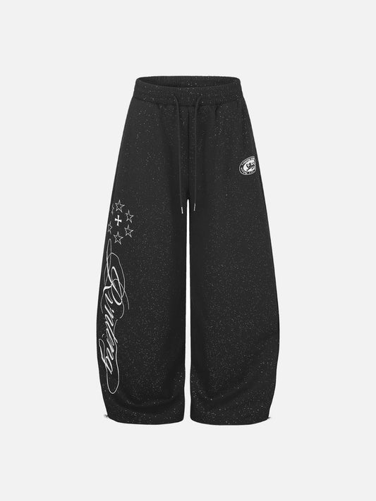 Front view of wide-leg embroidered fleece sweatpants in a relaxed fit