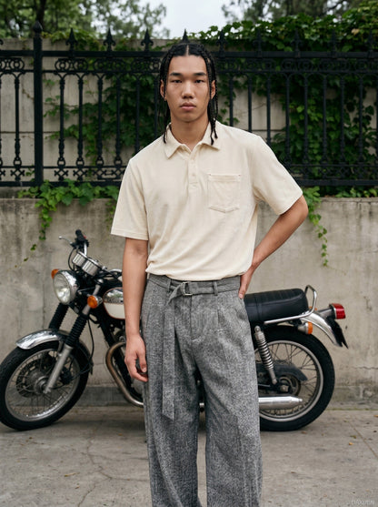 Model wearing loose velvet polo shirt styled for relaxed streetwear