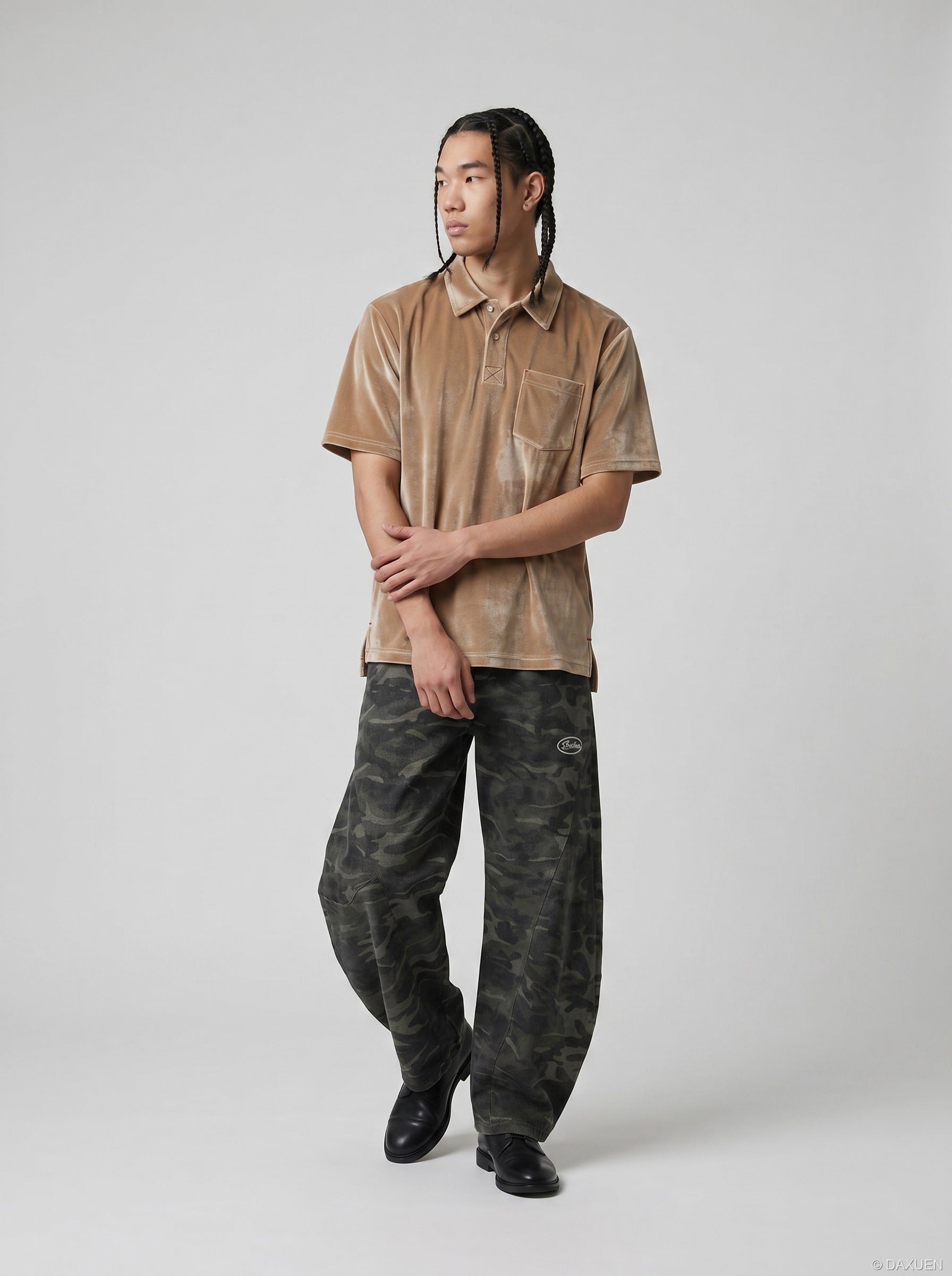 Loose velvet polo shirt shown in a full-length outfit from the front