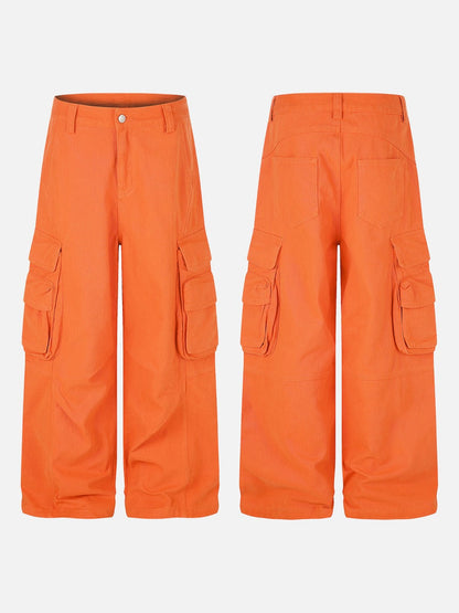 Detail of the waistband and fastening on orange cargo trousers