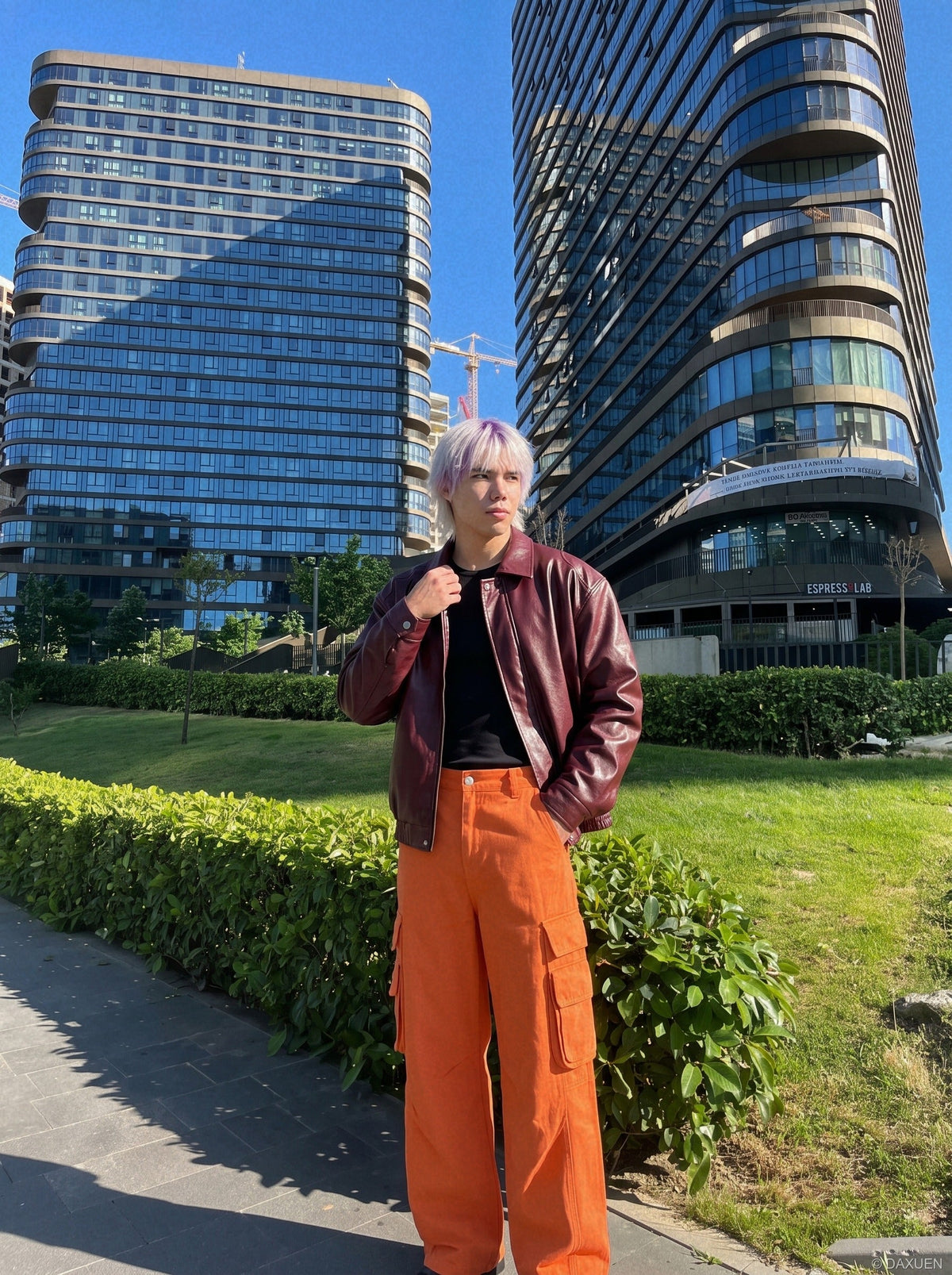 Orange wide-leg cargo trousers featuring practical side pockets