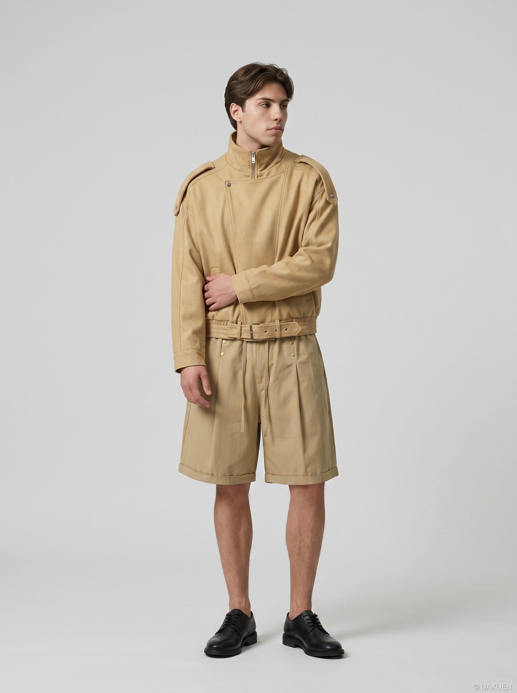 Model wearing relaxed-fit studded shorts in a casual pose
