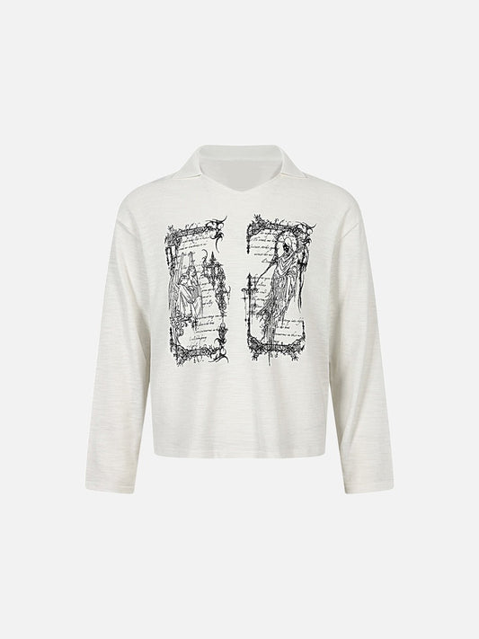 Front view of oversized graphic knit top with wing print in a relaxed fit