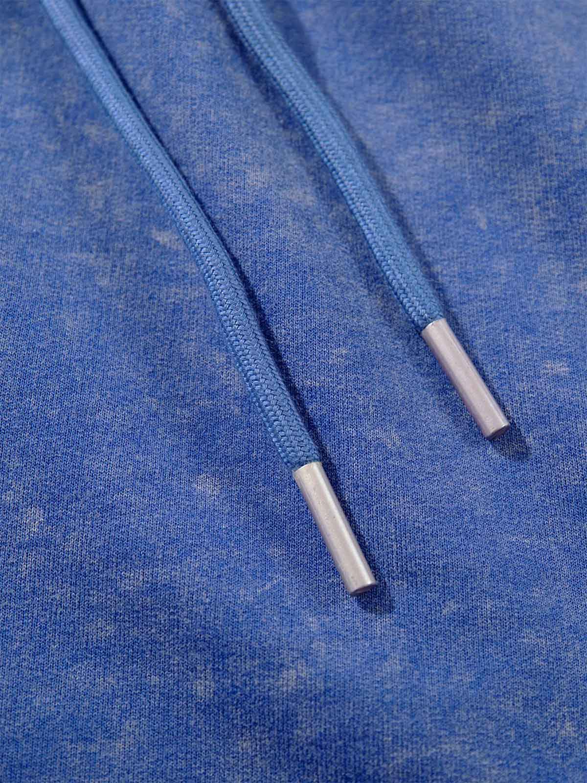 Detail of drawstring waistband on washed sweat shorts