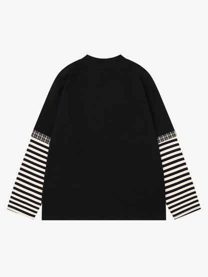 Close-up of graphic detail on oversized striped long sleeve T-shirt