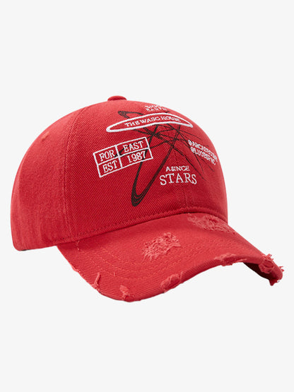 Close-up of distressed brim on embroidered baseball cap