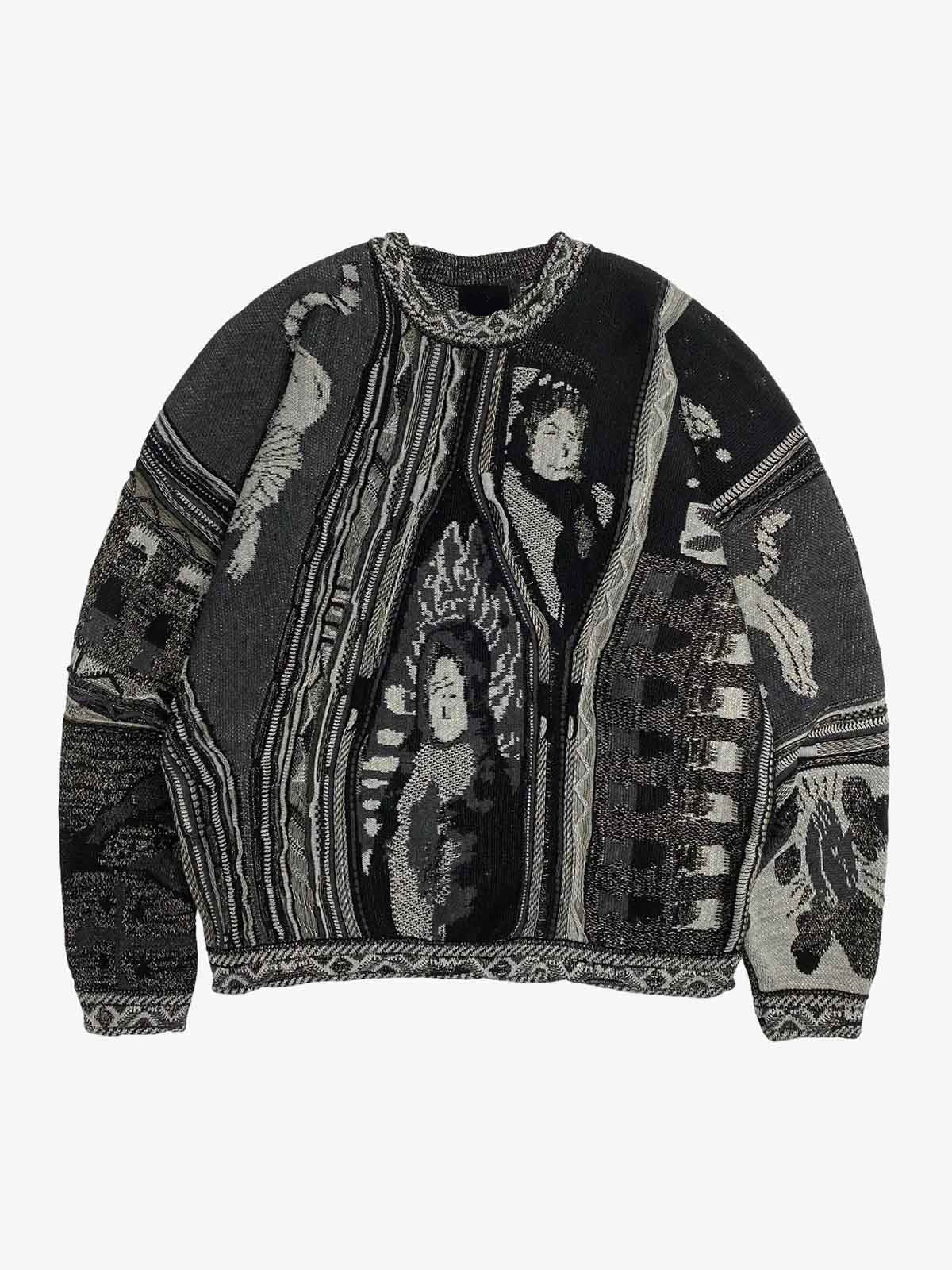 Close-up of the embroidered crest on the striped polo sweater