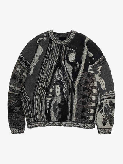 Close-up of the embroidered crest on the striped polo sweater
