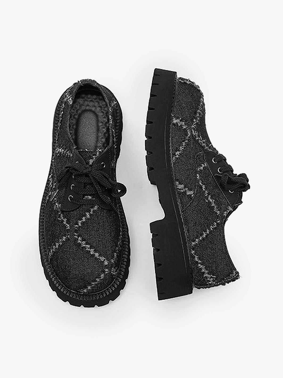 Black chunky platform derby shoes styled as statement everyday footwear