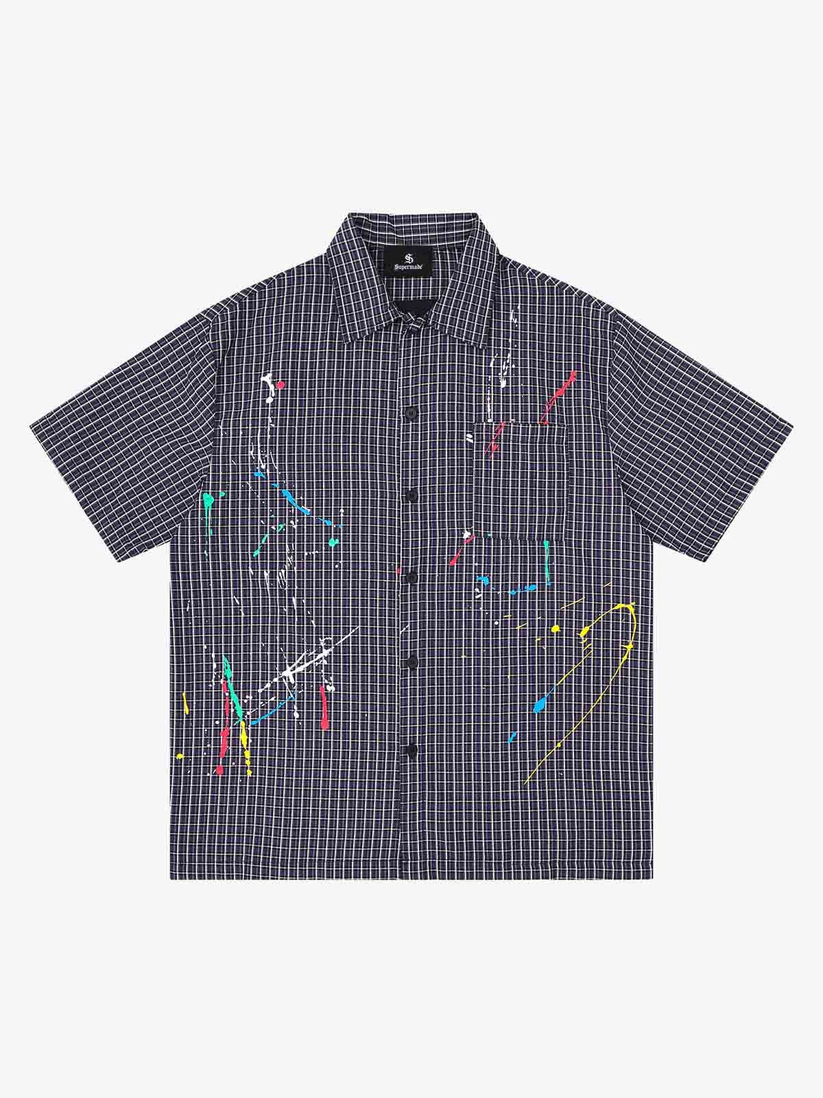 Close-up of embroidered detail on men's plaid shirt