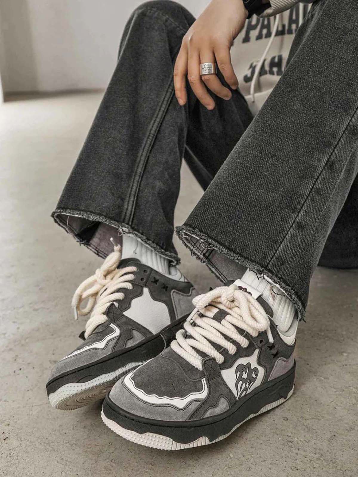 Top view of camouflage street trainers with laces neatly tied