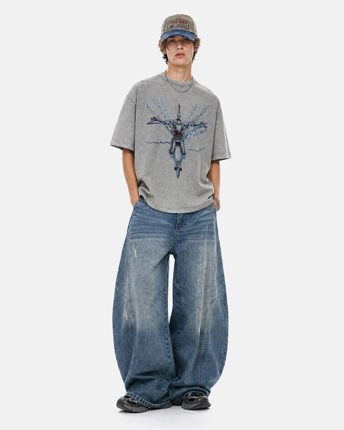 Model wearing oversized grey acid wash graphic T-shirt in cotton