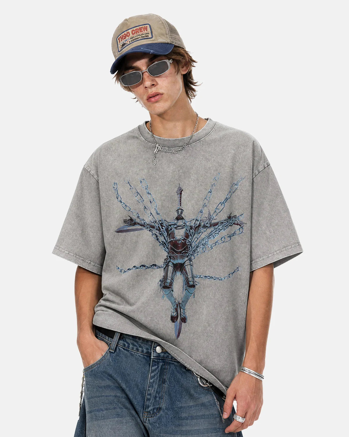 Detail of acid wash texture on grey oversized cotton graphic T-shirt