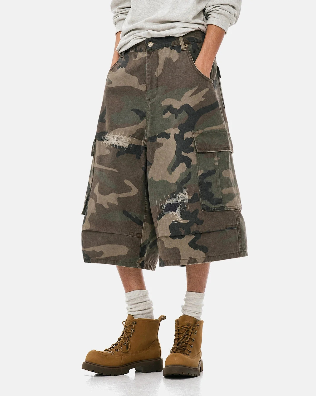 Close-up of distressed camouflage fabric on cargo shorts