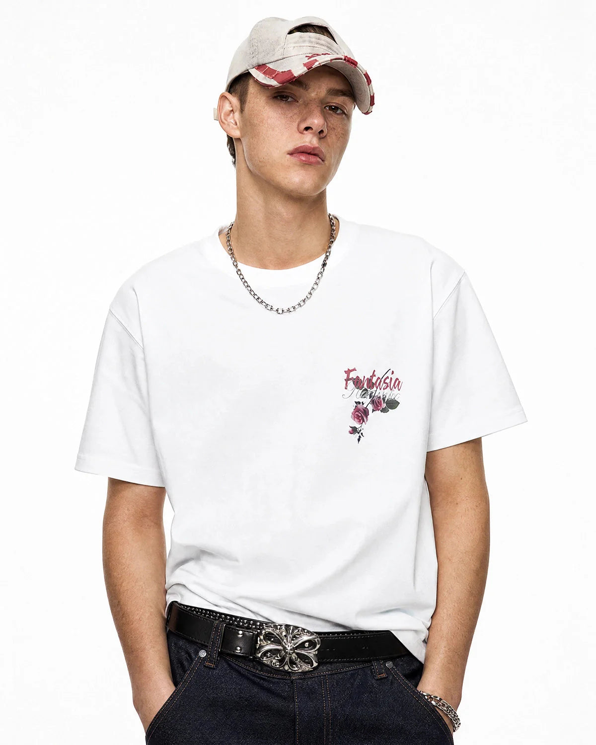 Model wearing cotton T-shirt showing floral graphic on the back