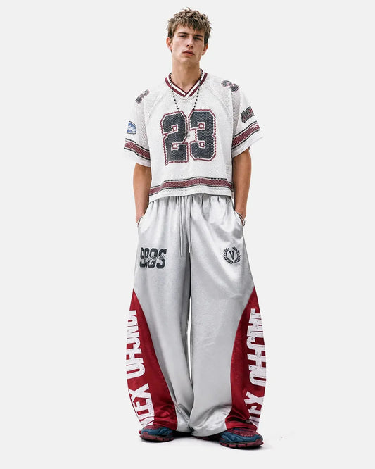 Front view of glossy contrast barrel sweatpants in a relaxed fit