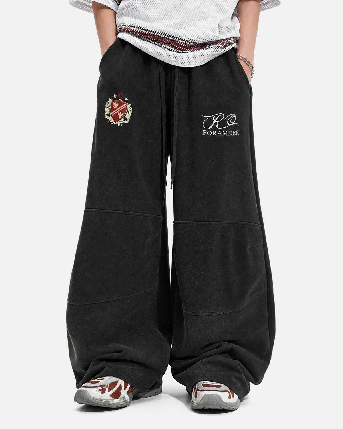 Back view of washed barrel-leg sweatpants in a gothic streetwear style