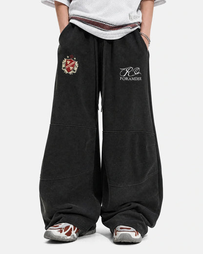 Back view of washed barrel-leg sweatpants in a gothic streetwear style