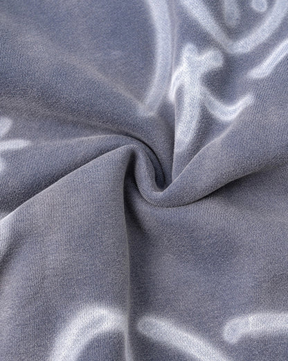 Detail of ribbed cuffs on the graffiti hoodie