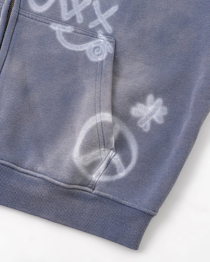 Casual styling of a washed graffiti zip-up hoodie