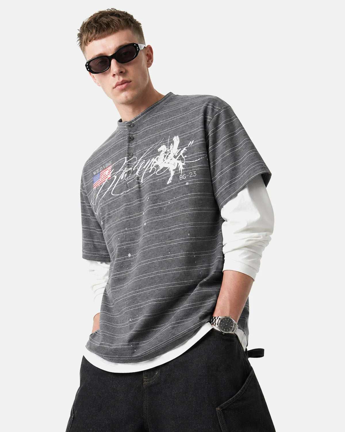 Detail of striped fabric and layered sleeve design on casual top