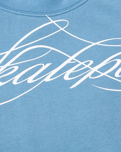 Detail view of fabric and Monkey Wash script print on baby T-shirt