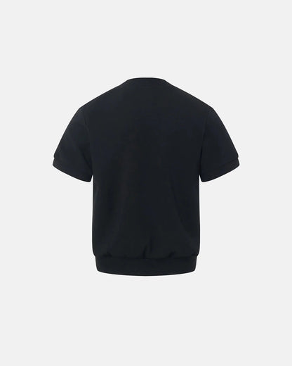 Close-up of the short sleeves and fine knit finish of the cardigan