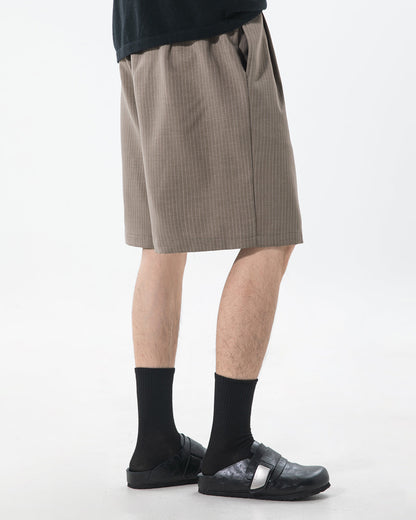 Men's smart pinstripe shorts styled for a polished outfit