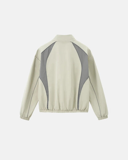 Back view of a loose reflective windbreaker jacket with bold colour blocking
