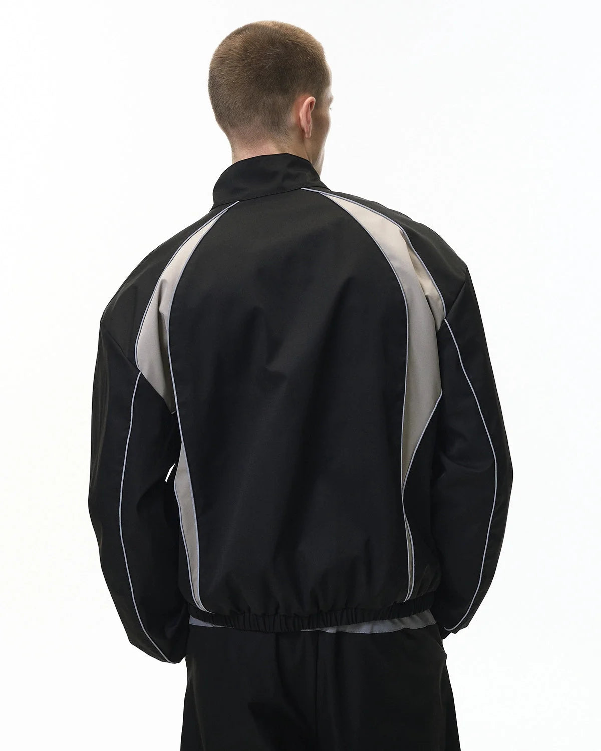 Windbreaker jacket showing its relaxed fit and full-length sleeves