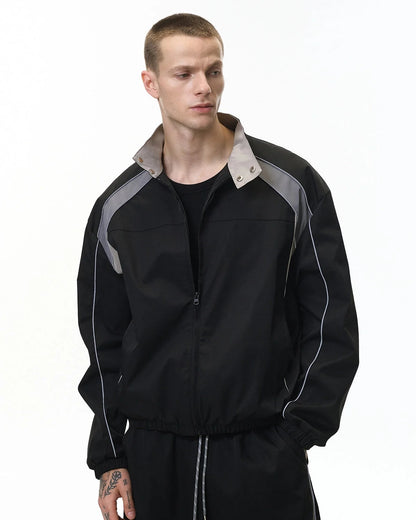 Close-up of the reflective fabric and colour-block design on the jacket