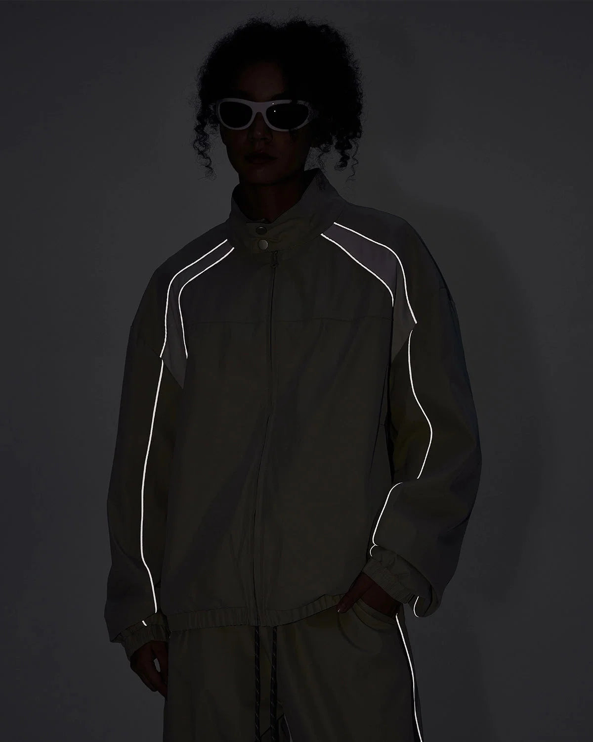 Side view of the reflective colour-block streetwear windbreaker jacket