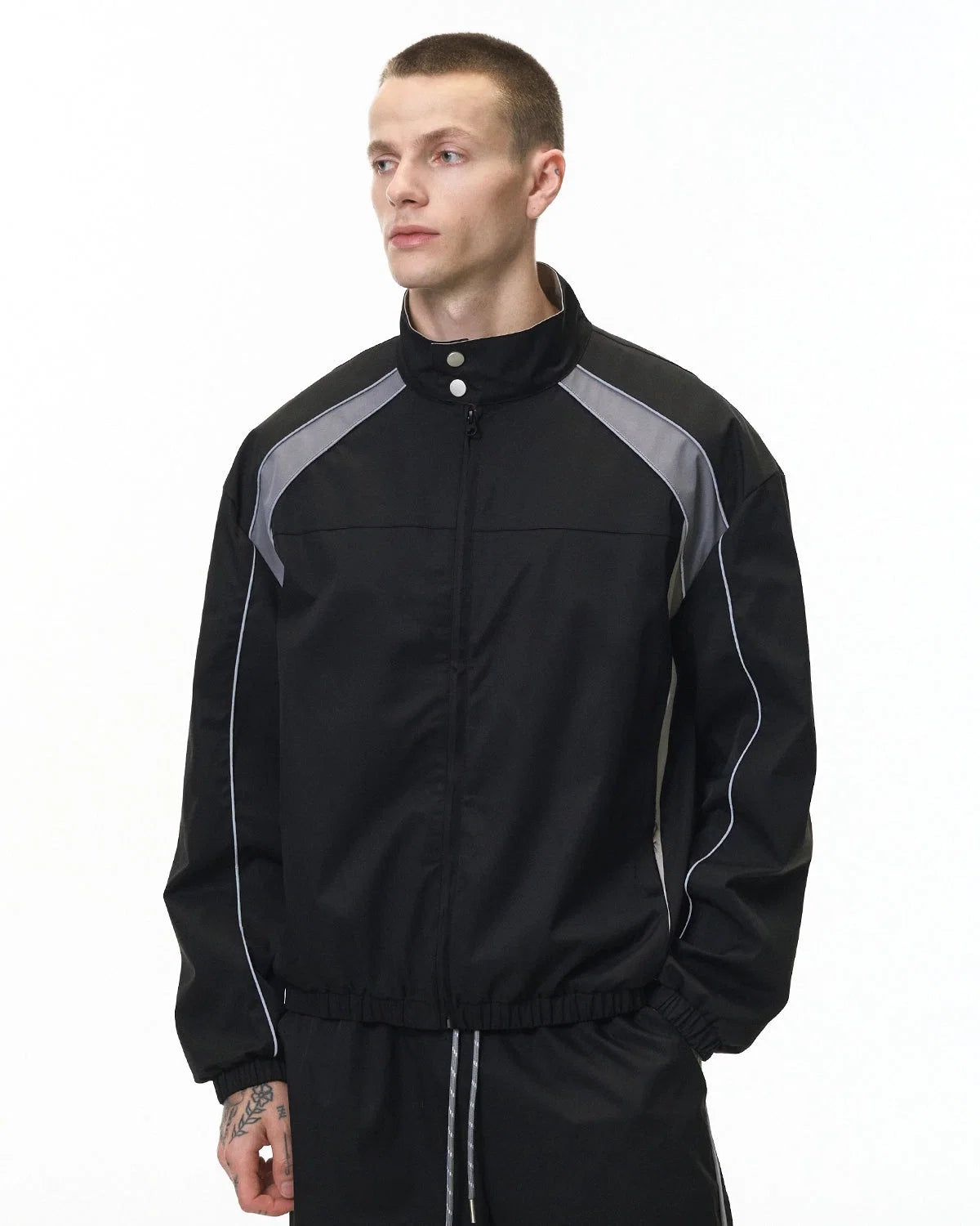 Reflective windbreaker jacket styled for a casual urban streetwear look