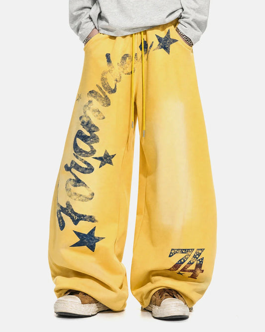 Star graphic barrel sweatpants shown from the front with a relaxed fit