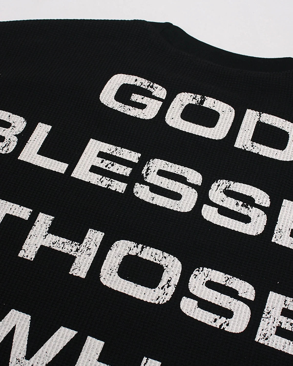 Graphic detail on a distressed waffle-knit long-sleeve T-shirt