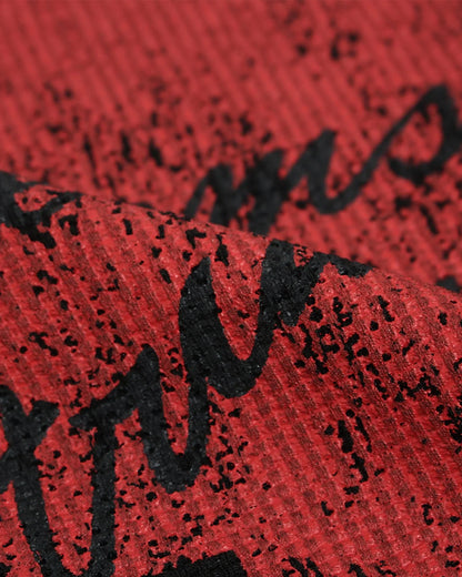 Long sleeves and crew neckline on a distressed graphic T-shirt