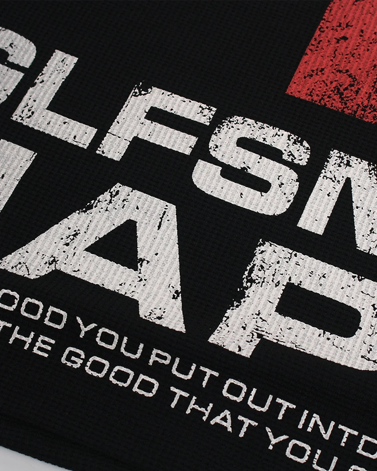 Close-up of the textured waffle-knit fabric and graphic design
