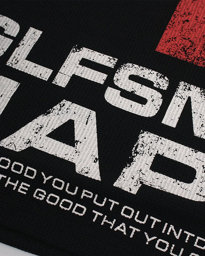 Close-up of the textured waffle-knit fabric and graphic design