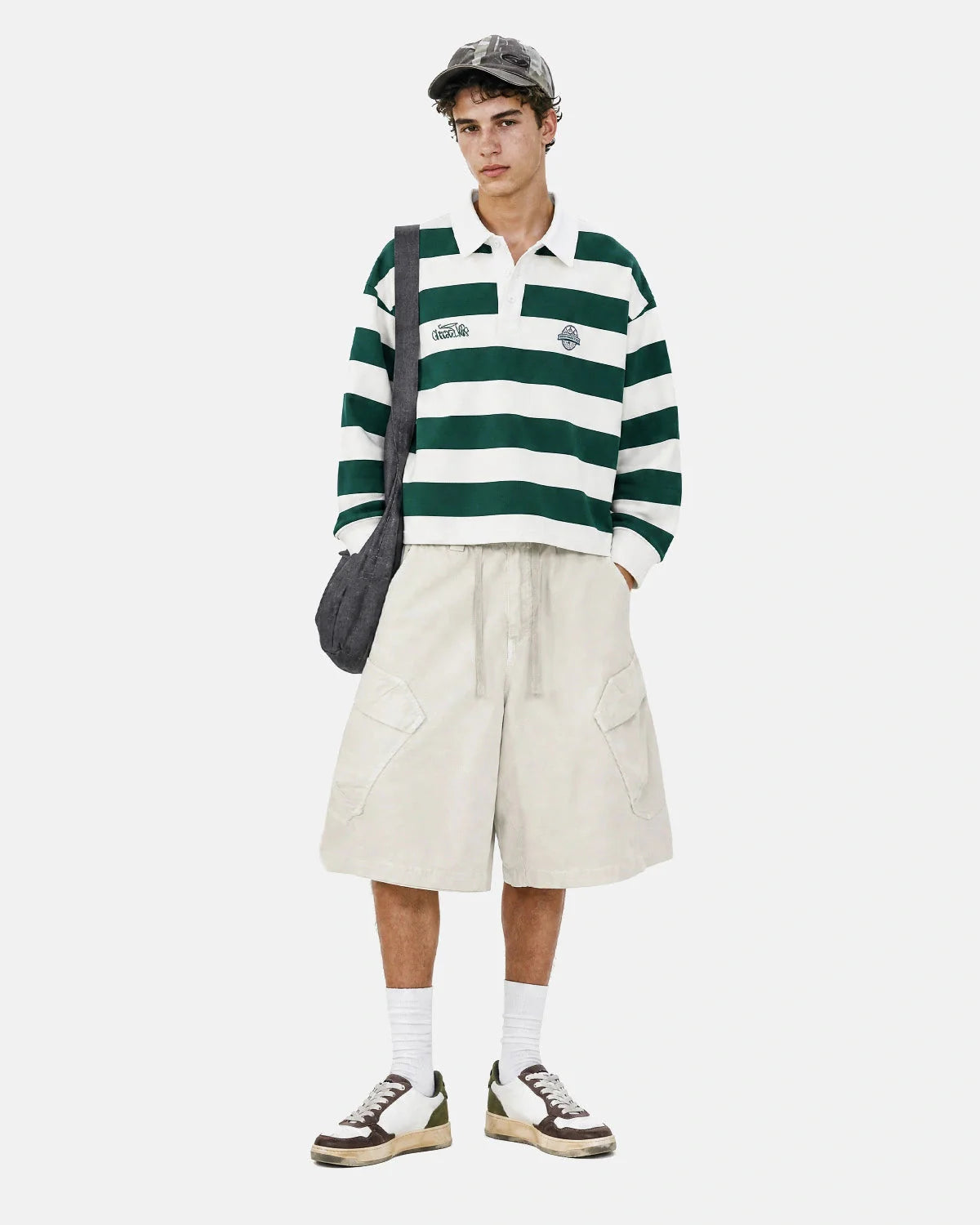 Angled front view of washed cargo shorts with multiple pockets