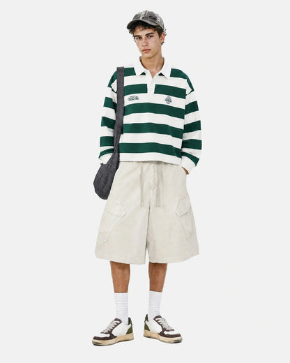 Angled front view of washed cargo shorts with multiple pockets