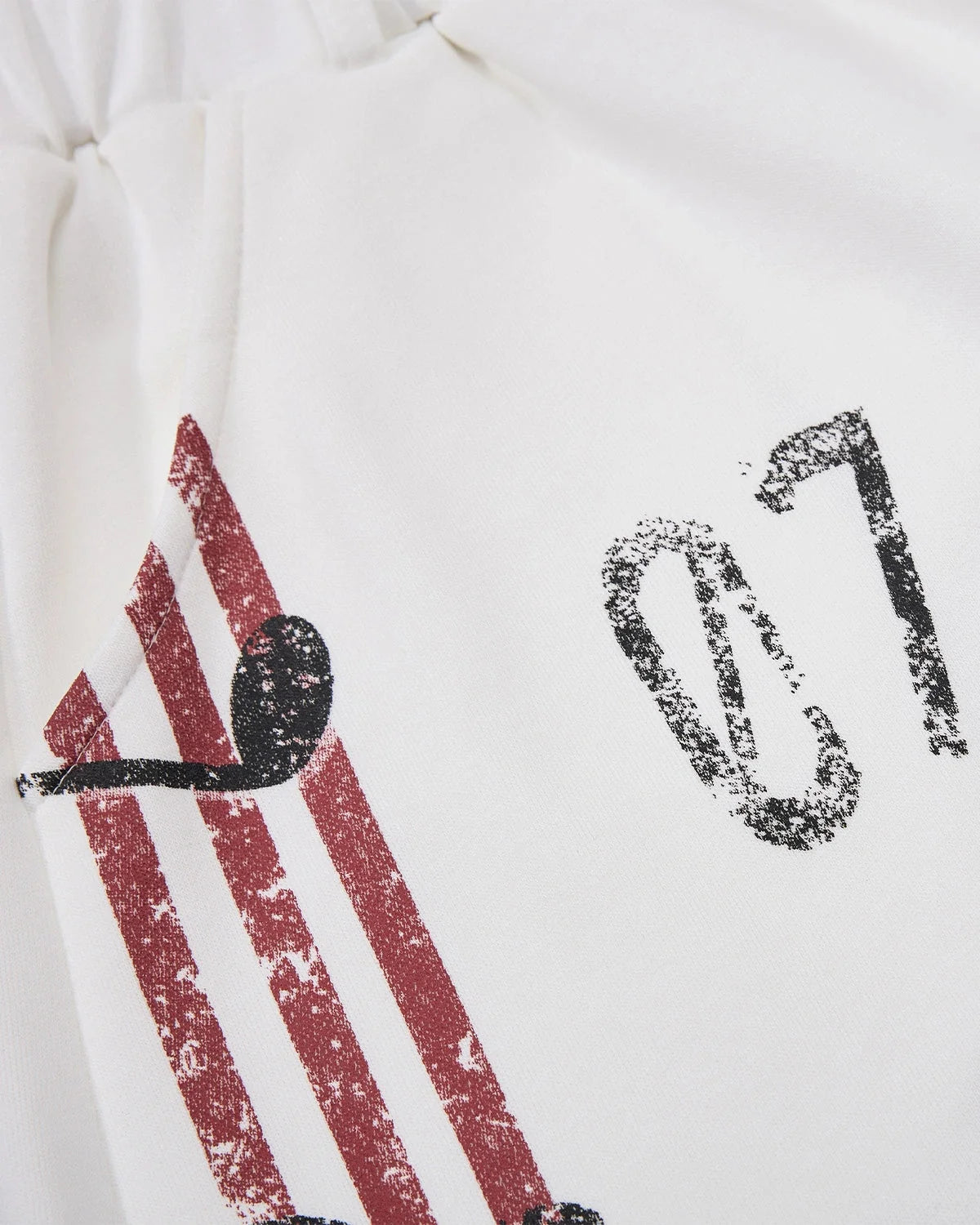 Music graphic barrel-leg joggers displayed as a complete garment