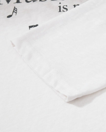 Detail of the crew neckline and long sleeves on the washed T-shirt
