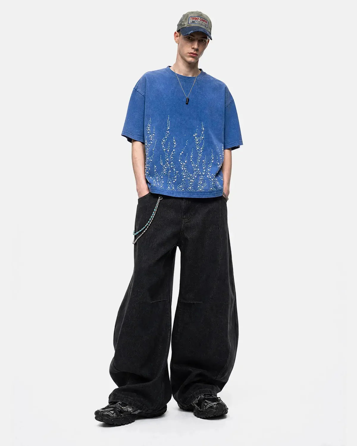 Front three-quarter view of the washed rhinestone flame boxy T-shirt