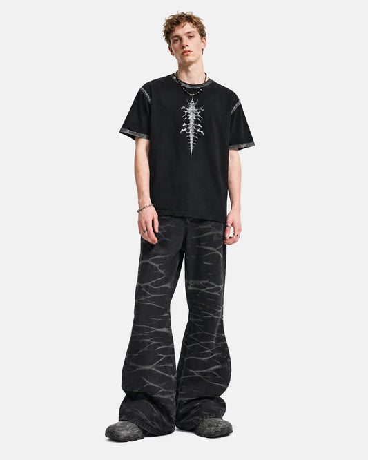 Front view of whisker wash bootcut jeans in blue denim